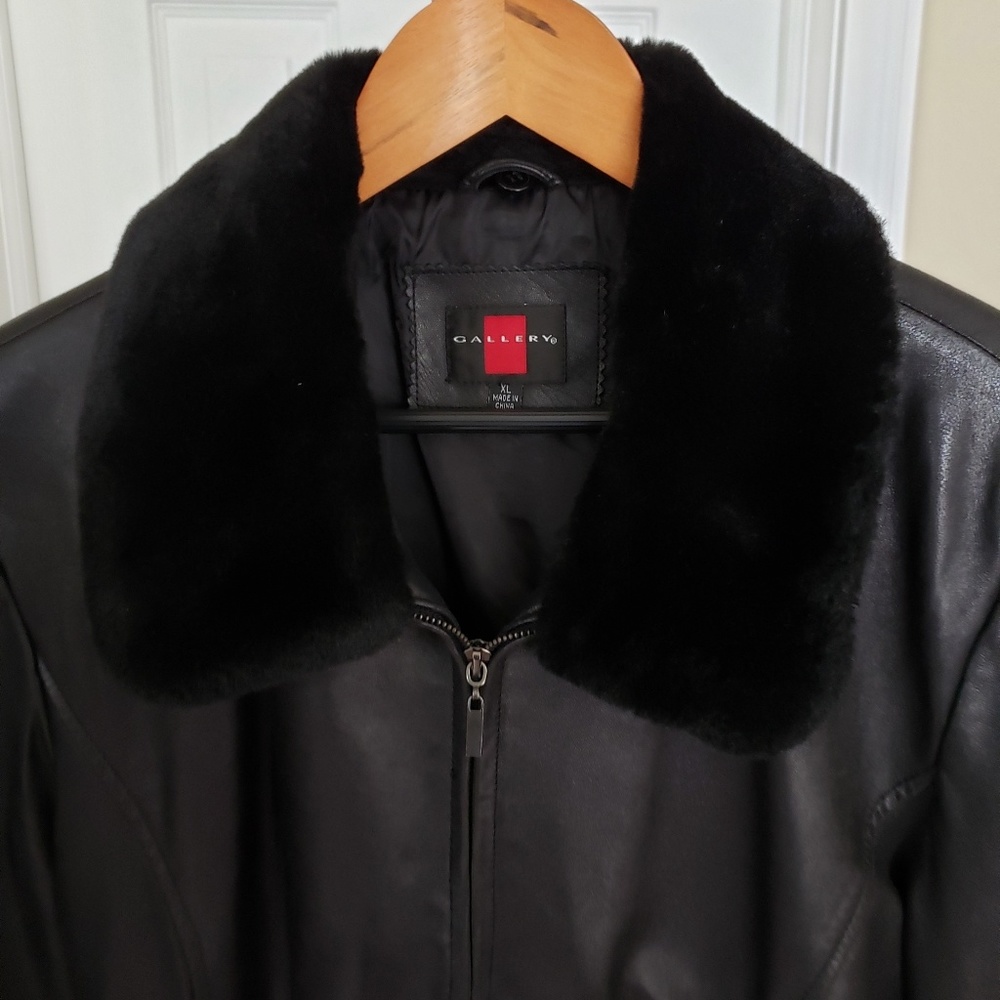 Black leather jacket with detachable fur collar.